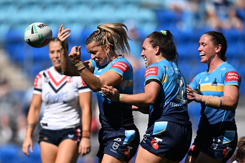 Lauren Brown celebrates scoring one of her two tries against the Roosters.