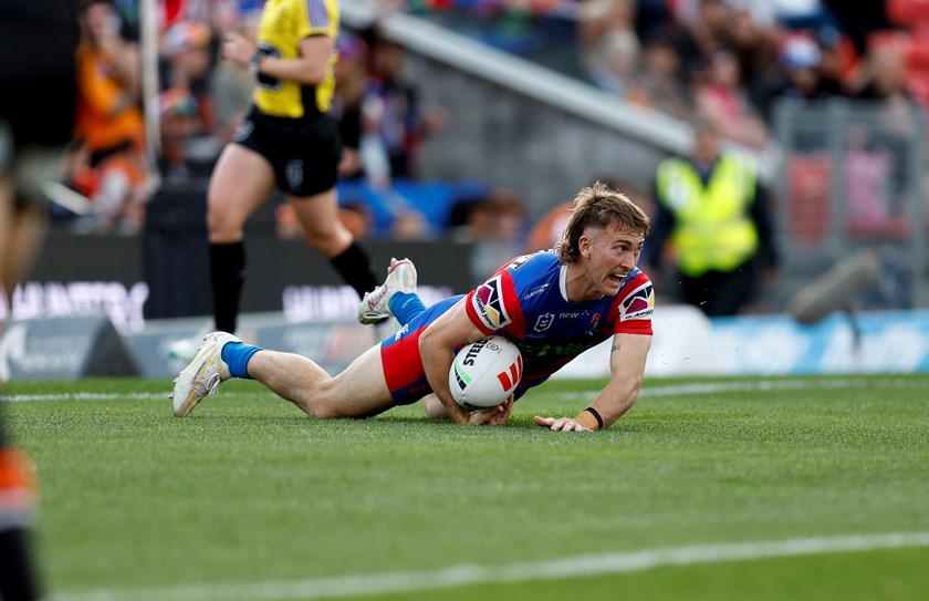 Fletcher Sharpe scoring one of his four tries in the win against Wests Tigers.