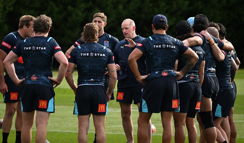 Coach Michael Maguire talks to the squad in camp.