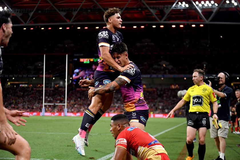 Reece Walsh celebrates Jesse Arthars' try against the Dolphins.