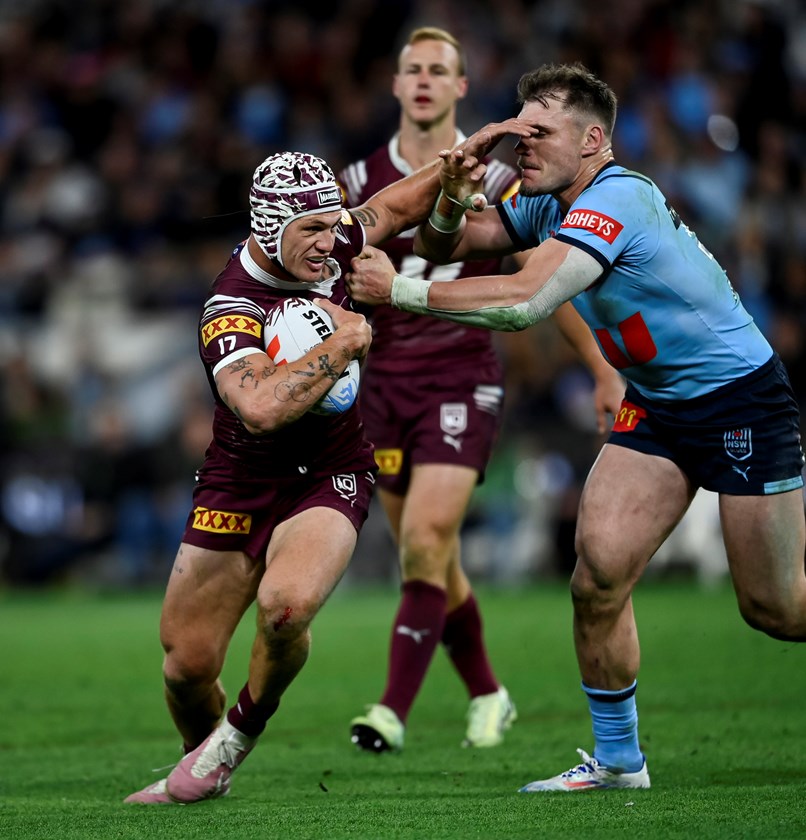 Kalyn Ponga attempts to fend off Angus Crichton.