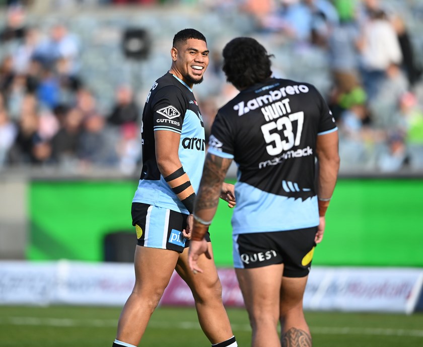 Tuku Hau Tapuha with Sharks forward Royce Hunt. 