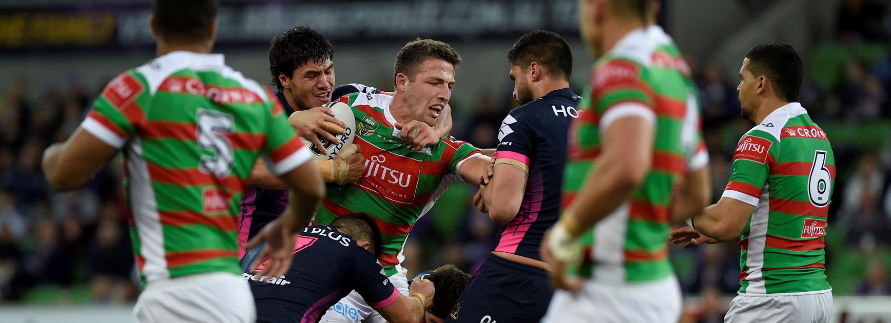 South Sydney star Sam Burgess takes on the Storm.