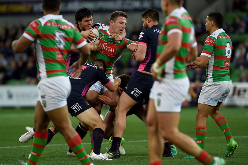 South Sydney star Sam Burgess takes on the Storm.