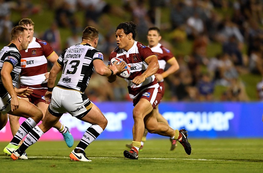 Taulima Tautai hits the ball up for Wigan in Wollongong.