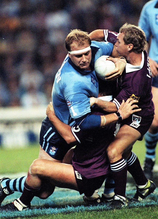 Blues forward Paul Sironen takes on Maroons halfback Allan Langer in 1994.