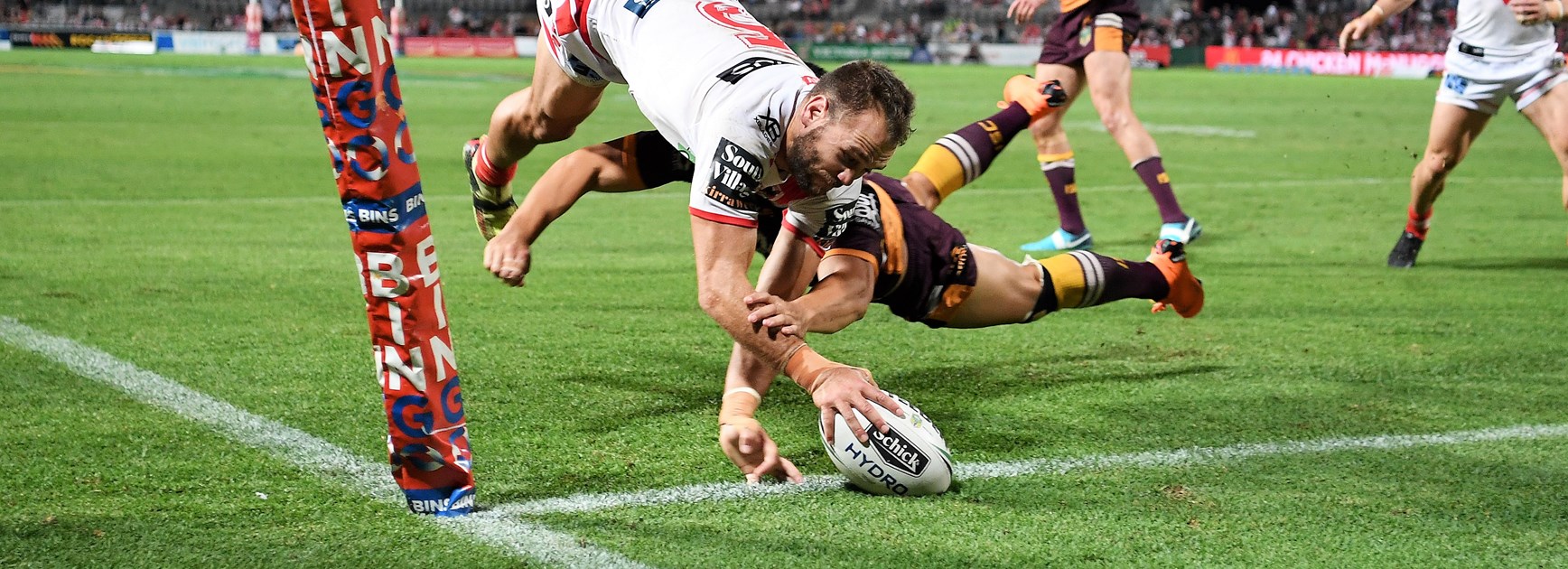 Dragons winger Jason Nightingale crosses for a try.