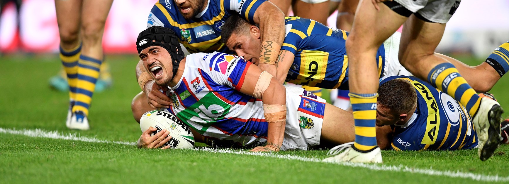 Sione Mata'utia scores against Parramatta.