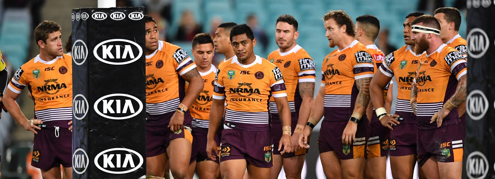 Broncos gather behind the posts after a Bulldogs try.