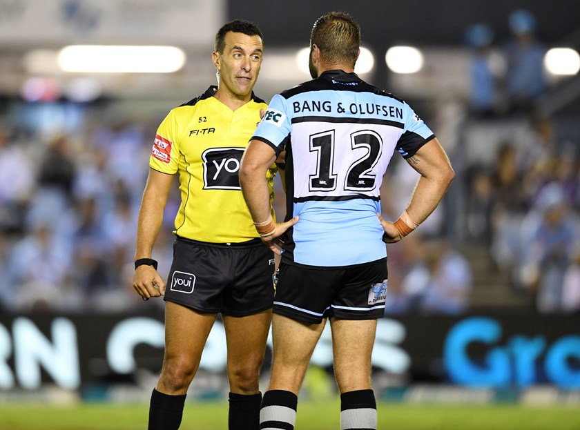 Referee Matt Cecchin and Sharks co-captain Wade Graham.