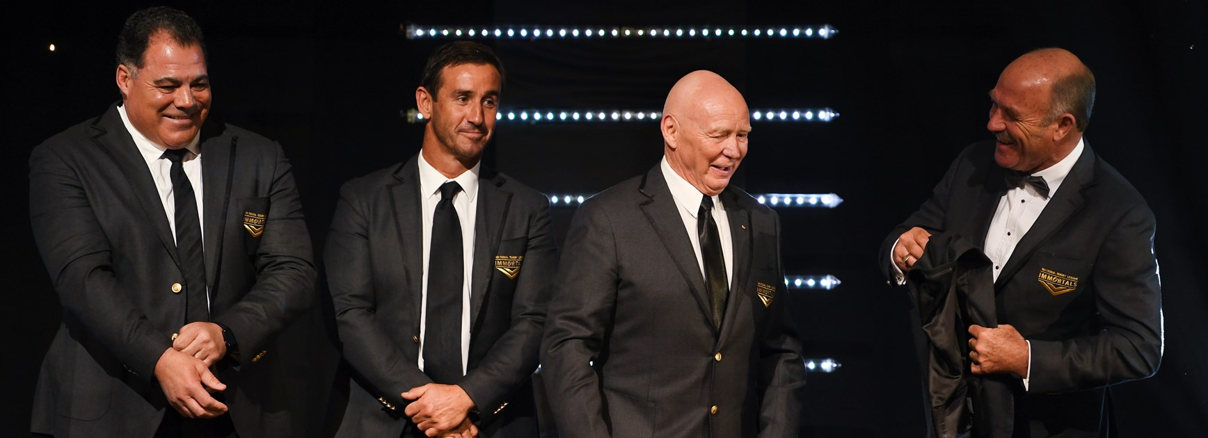 Meninga receives his Immortals jacket from Andrew Johns, Bob Fulton and Wally Lewis.