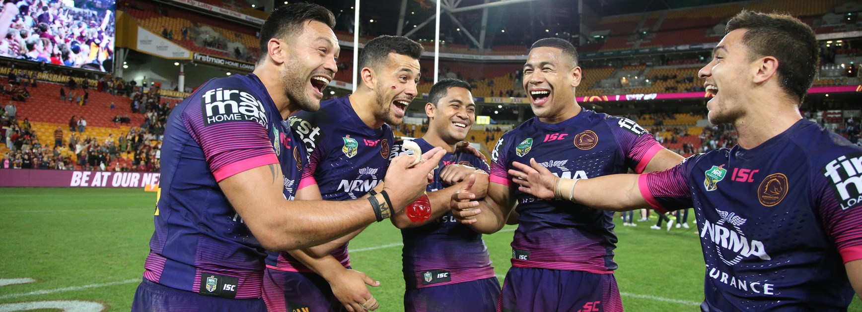 Brisbane Broncos players celebrate.