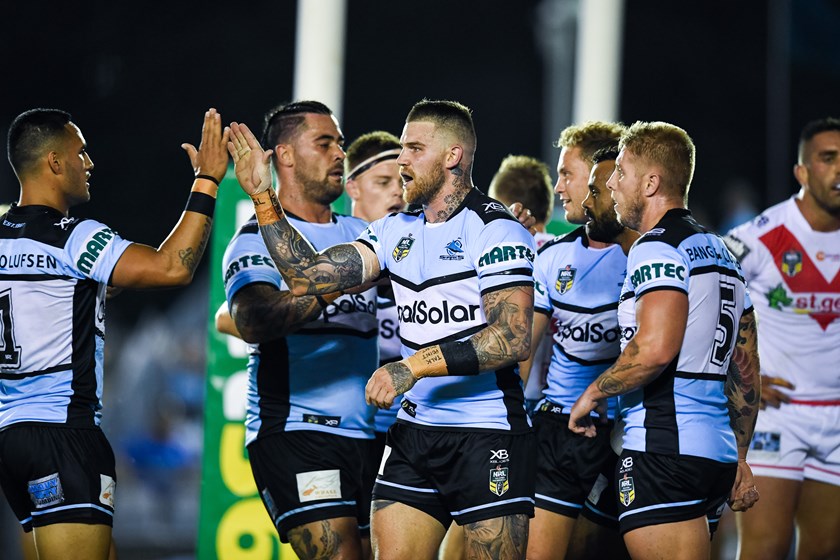 Cronulla's Josh Dugan high-fives Valentine Holmes.