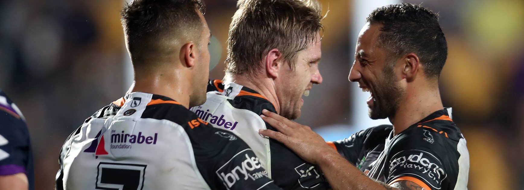 Luke Brooks, Chris Lawrence and Benji Marshall celebrate.