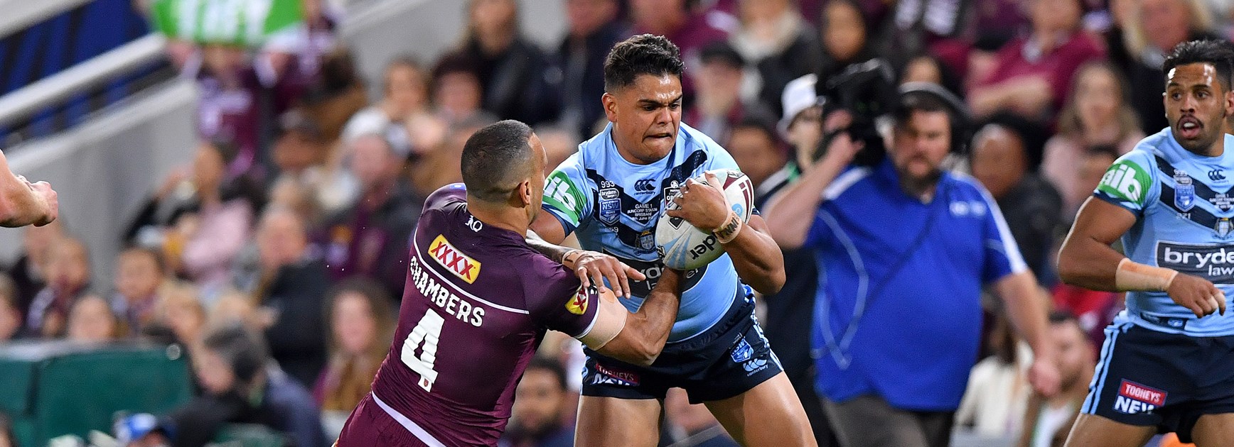 Latrell Mitchell tries to evade Will Chambers.