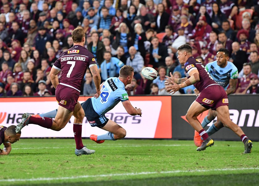 Jack Wighton throws an intercept pass to Dane Gagai in Origin I.