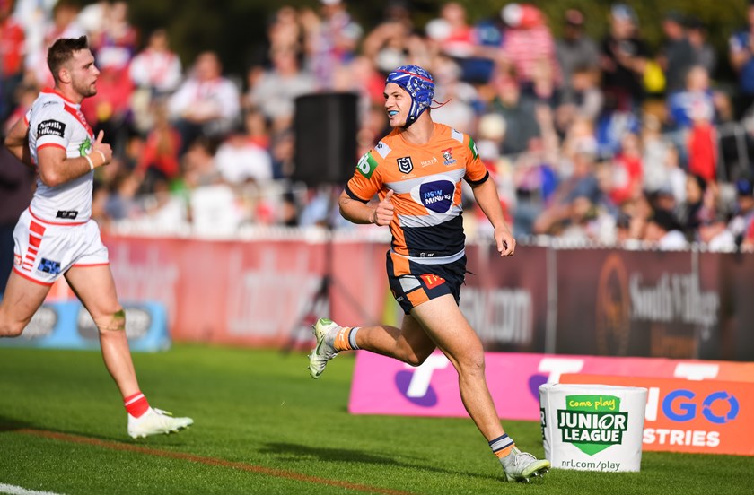 Knights fullback Kalyn Ponga grabs a try.