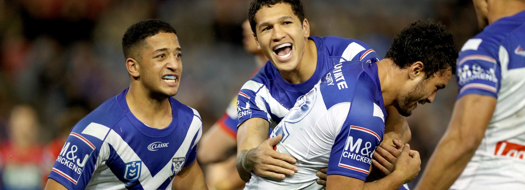 The Bulldogs celebrate Corey Harawira-Naera's try against Newcastle.