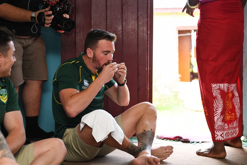 Clint Gutherson shares a local custom with kava in Maika Sivo's village.