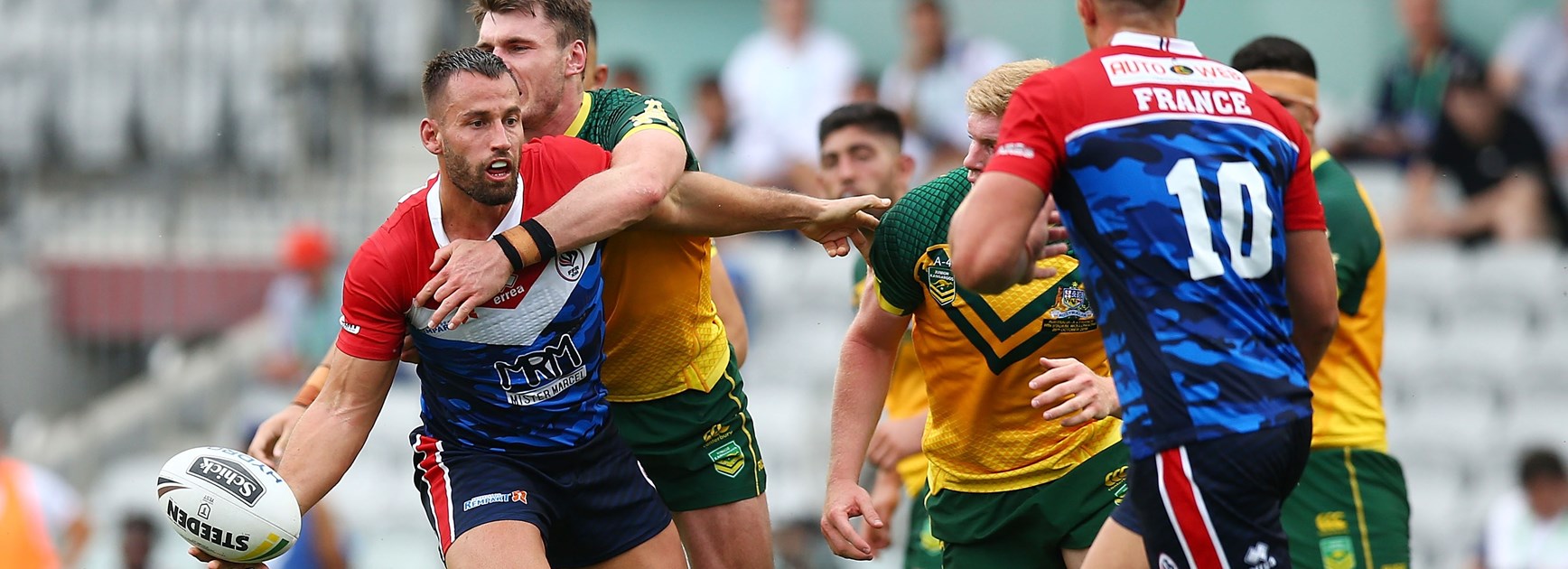 Bastien Canet offloads for France against the Junior Kangaroos.