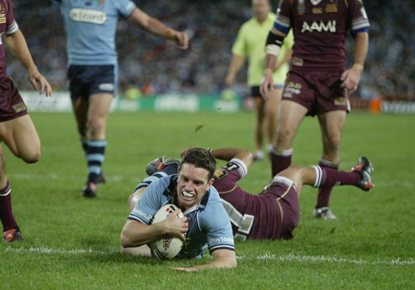 Danny Buderus scores after a brilliant interchange of passing with Andrew Johns.