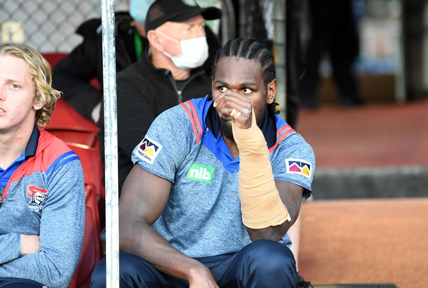 Edrick Lee watches on after his wrist injury.