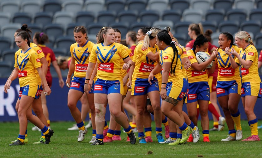 The women's City Origin team celebrates a try.