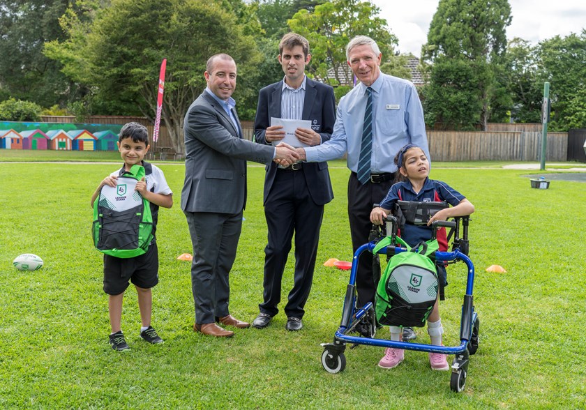 Special Olympics Australia CEO Pierre Comis with athlete leader Harry Werner and St Lucy's principal David Raphael. 