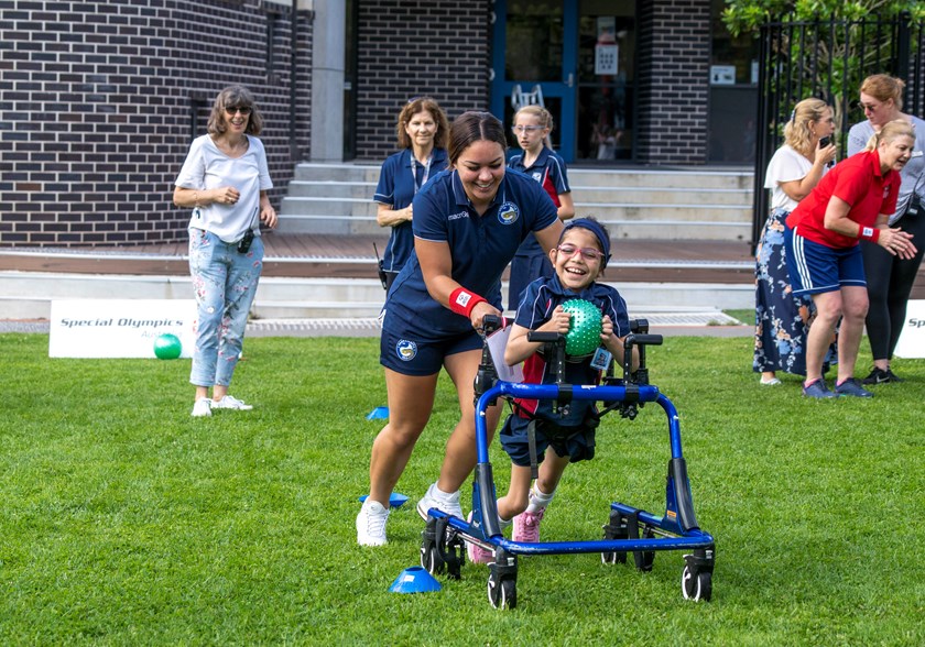 Eels NRLW player Kennedy Cherrington with a St Lucy's School student. 