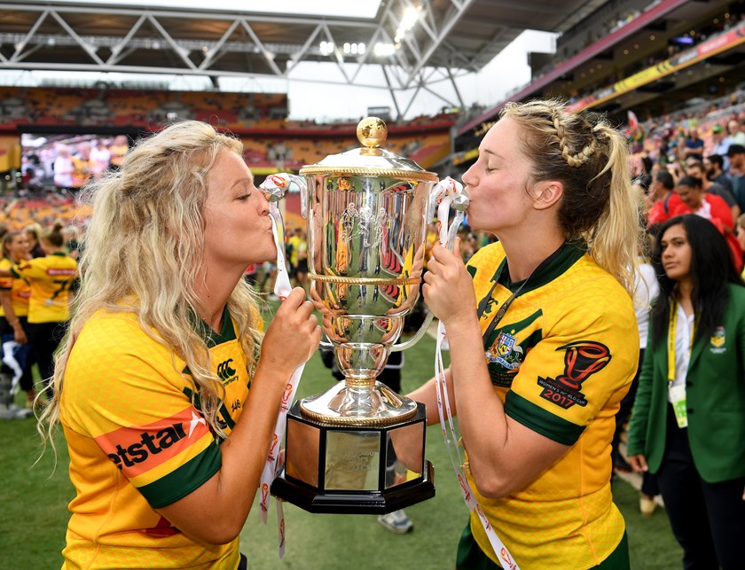 Talesha O'Neill and Kezie Apps celebrate with the World Cup trophy in 2017.