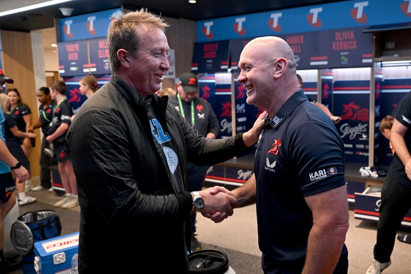 Sydney Roosters NRL coach Trent Robinson congratulates John Strange after the club's grand final win.