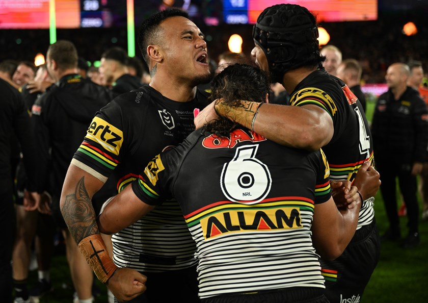 Spencer Leniu, Stephen Crichton and Jarome Luai celebrate after winning the 2022 grand final.