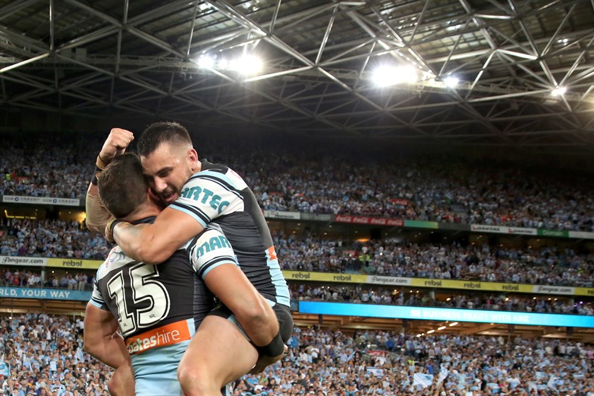 Jack Bird celebrates winning the 2016 grand final with Chris Heighington