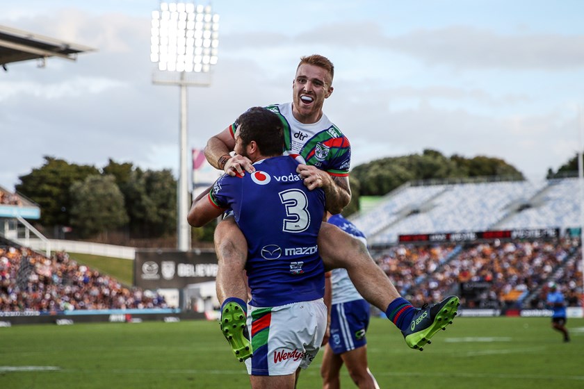 Adam Keighran celebrates a Warriors try with Peta Hiku in the opening round of 2019.