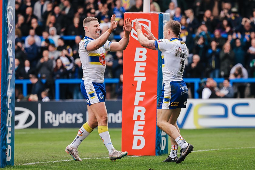 Matt Dufty (right) celebrates with Warrington captain George Williams after scoring a try.