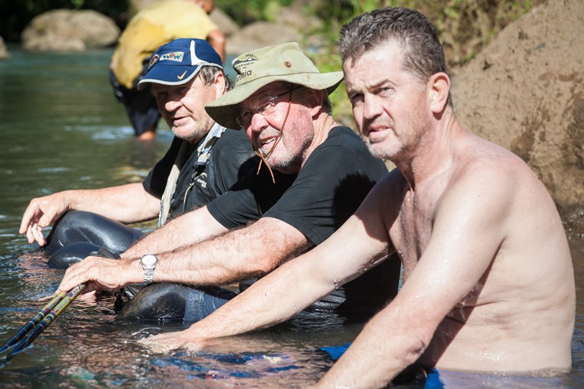 Tom Raudonikis, Roy Masters and Phil Sigsworth cool off along the Kokoda Track. 